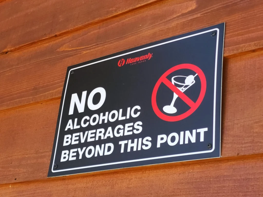 Sign stating "No alcoholic beverages beyond this point" – used to illustrate alcohol restriction for liver health