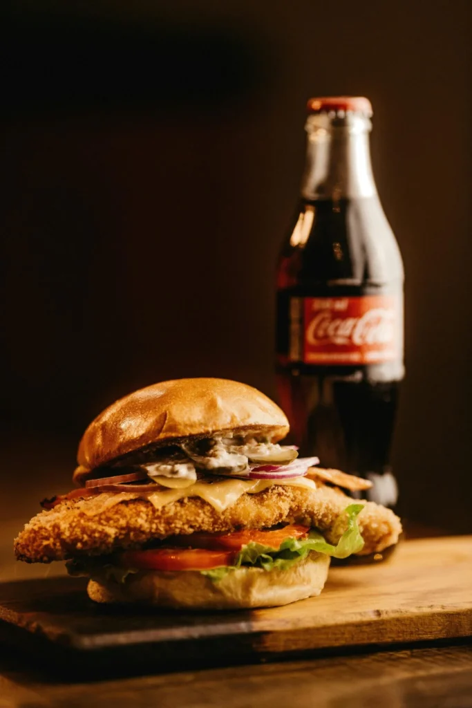 Fried chicken burger with soda – typical fast food to avoid on a NAFLD-friendly diet