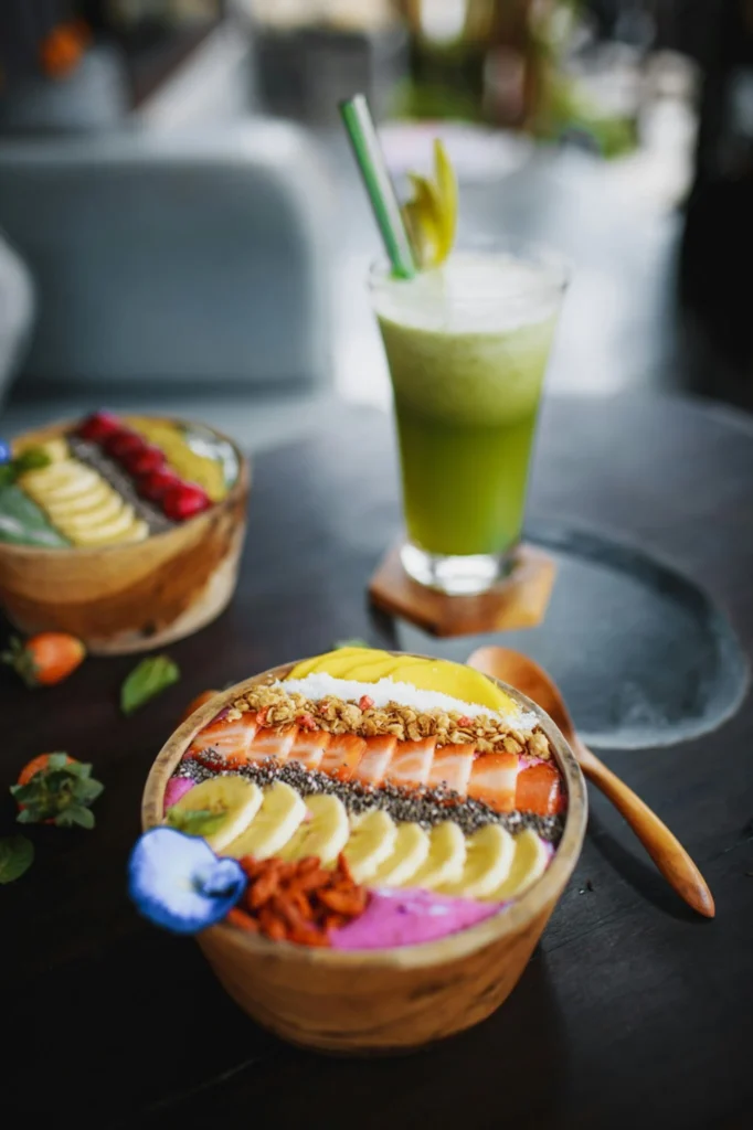 Colorful fruit smoothie bowls with banana, berries, chia seeds, and green detox juice – ideal for NAFLD-friendly diet
