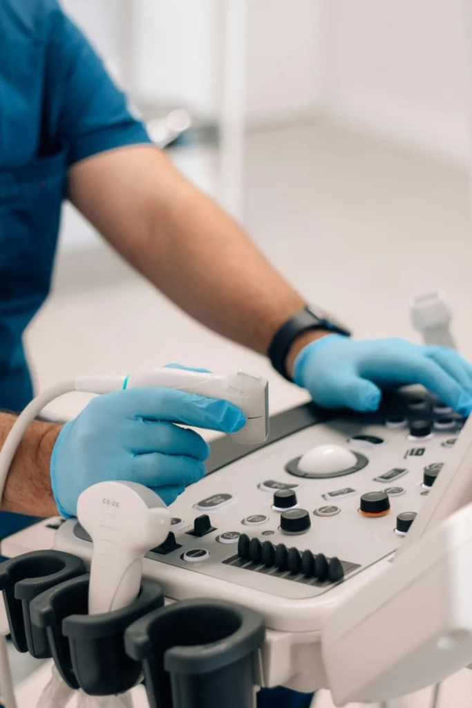 Medical professional preparing an ultrasound machine – diagnostic imaging for fatty liver and liver enzyme analysis